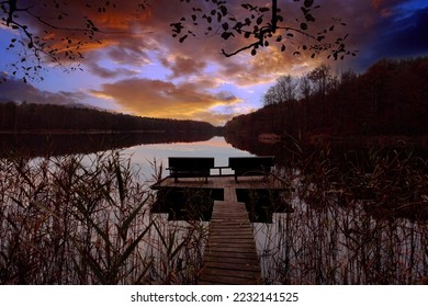 Bench for anglers on the shore of the lake, autumn sunset landscape - Shutterstock ID 2232141525
