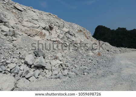 Bench of blasted limestone in limestone mining, quarry.