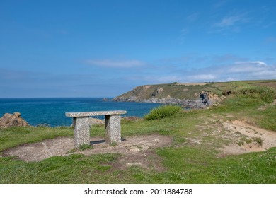 Bench at Church Cove, Gunwalloe in Cornwall on a summers day