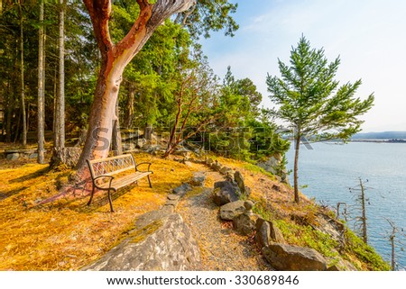 A bench with gorgeous view at mountain lake, British Columbia, Canada.