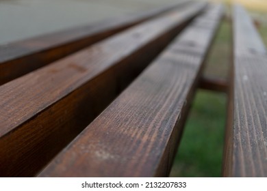 Bench made of wooden planks in the park, close up  - Powered by Shutterstock