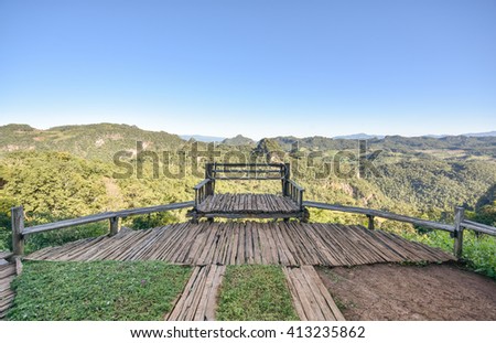 bench on the edge of dropdown with view on the mountains. Bann Jabo Maehongson Thailand