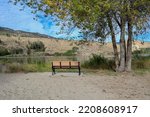 A bench on the lakeside, Skaha Lake, Okanagan Falls, British-Columbia, Canada