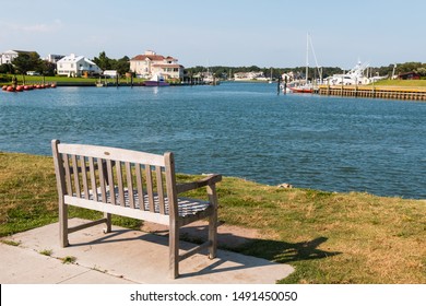 A Bench Overlooks Rudee Inlet In Virginia Beach, Virginia.