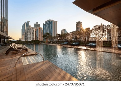 Bench in the park along the lake. The building has a modern foreground. - Powered by Shutterstock