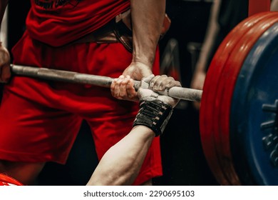 bench press powerlifting competition, hand athlete powerlifter hold barbell bar - Powered by Shutterstock