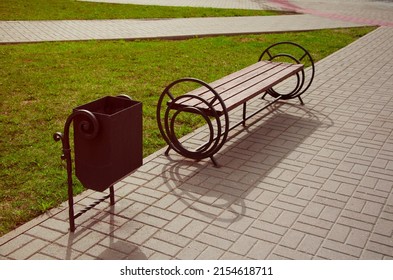 Bench and rubbish bin in the park, top view. A place of rest for tourists and pedestrians on the city street. - Shutterstock ID 2154618711