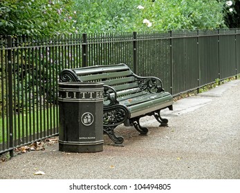 Bench And Trash Can In A London Park