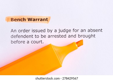 bench warrant   word highlighted  on the white paper