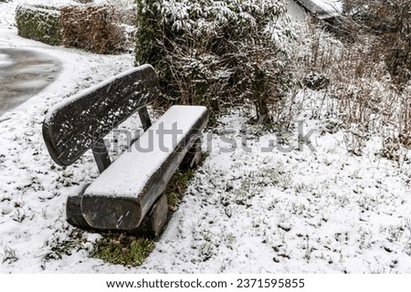 The benches covered with snow in winter