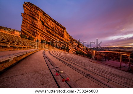 benches at red rocks amphitheater in denver colorado with carnation flowers 