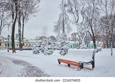 Benches in the winter city park which has been filled up with snow - Shutterstock ID 2216376833