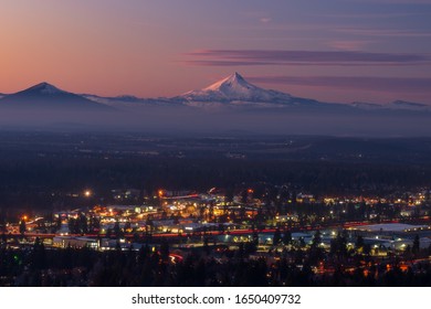 Bend Oregon cityscape with Mt Jefferson at sunset