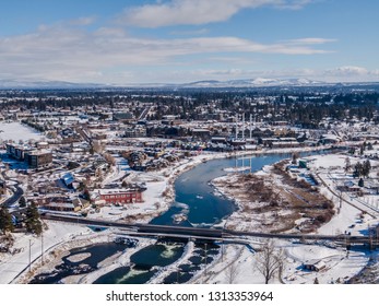 Bend, Oregon Whitewater Park with Old Mill District during Winter with Snow