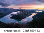 The bend of the river in the mountains at dawn. Mountain river in early morning at dawn. Beautiful sunrise over canyon river. River canyon in mountains at dawn