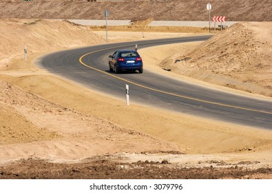 Bend of the road in a deserty area