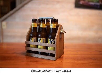 Bend, OR / USA - January 1 2019: Six Pack Of Widmer Hefeweizen Beer In The Wooden Carrying Case.