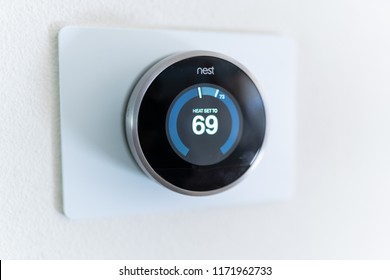 Bend, OR / USA - September 1, 2018: Nest learning thermostat on the wall.