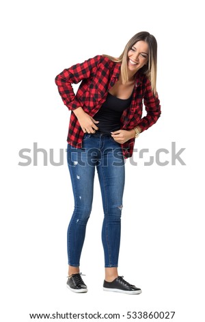 Bend young pretty woman in casual clothes laughing loudly. Full body length standing portrait isolated over white background. 