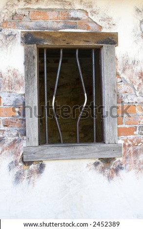 Bended bars on a window frame depicting jailbreak