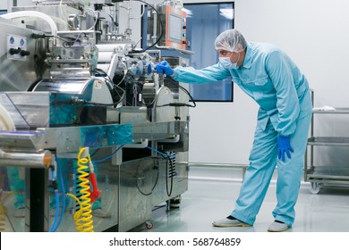 bended scientist works with manufacture machine