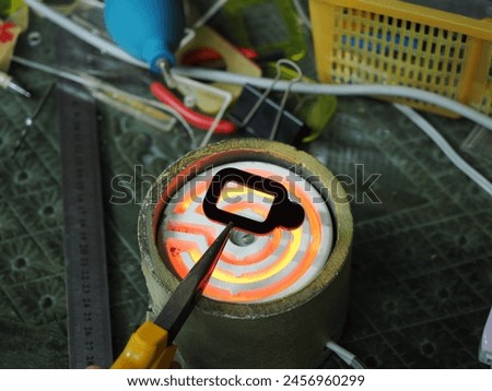 Bending plastic frames with a hot oven.