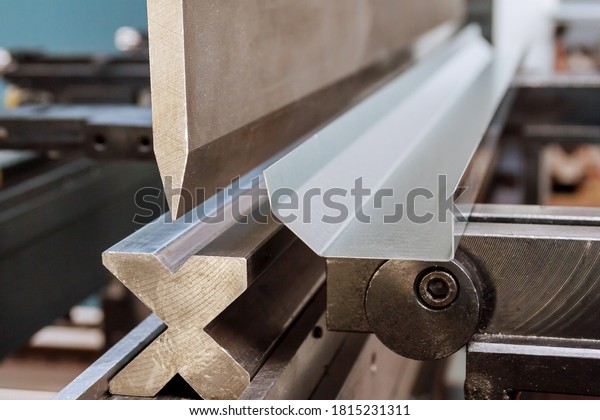 Bending sheet metal with a hydraulic machine at\
the factory