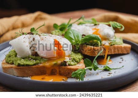 Benedict eggs on avocado toast. Great healthy and nutritious breakfast.