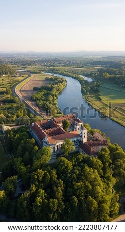 Benedictine Abbey in Tyniec is stunning monastery above the river. Historical church on rock with medieval look and mood. Drone footage of this chapel. Landscape of Poland rural countryside sunset.
