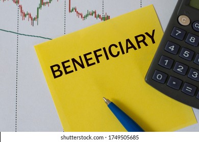 BENEFICIARY word on yellow sheet on table with pen, calculator and graph. Business and finance concept. - Shutterstock ID 1749505685