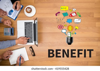 BENEFIT Business team hands at work with financial reports and a laptop - Shutterstock ID 419555428