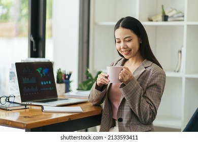 Benefits Of Remote Work. Dreamy Lady Enjoying Coffee During Work On Laptop Computer In City Cafe, Smiling And Looking Aside. Young Freelancer Having Break While Working Online In Internet