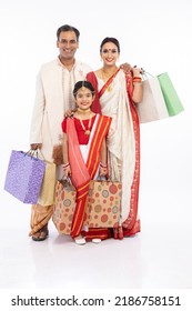 Bengali Family With Shopping Bags Over White Background.