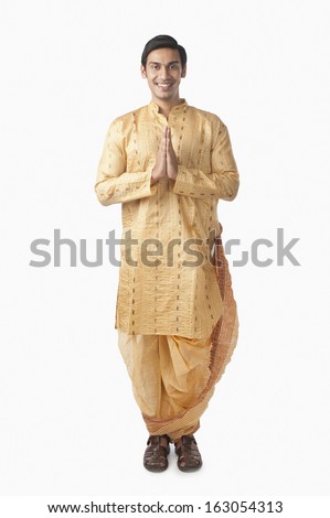 Bengali man standing in a prayer position