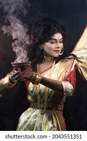 Bengali Married Women Performing Dhunuchi Dance On The Occasion Of Durga Puja With Sari And Gold Jewelry