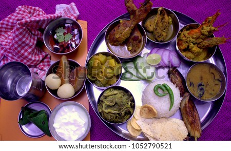 Bengali Thali with Vegetables , Chicken , Pron, Ilish and Sweets
