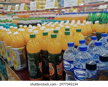 Bengaluru India, May 21, 2021. Carbonated Juice , Bottled Mineral Water, Soft Drinks Arranged In Racks And Shelfs In A  Super Market.