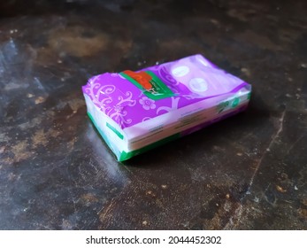 Bengkulu, Indonesia - September 20th, 2021 - A Packet Of Facial Tissue Is On The Cement Floor