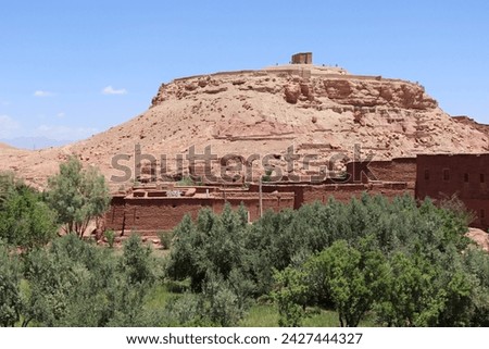 Aït Benhaddou castle with old red berber village ksar houses near Marrakesh, historic UNESCO tourist landmark and traditional film location in moroccan landscape of Atlas mountains, Morocco, Africa.