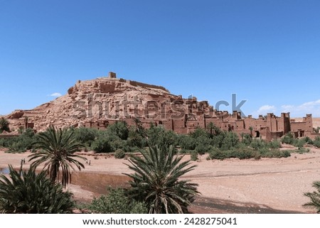 Aït Benhaddou castle with old red berber village ksar houses near Marrakesh, historical UNESCO tourist landmark and traditional film location in moroccan landscape of Atlas mountains, Morocco, Africa.