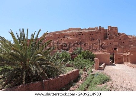 Aït Benhaddou castle with old red berber village ksar houses near Marrakesh, historic UNESCO tourist landmark and traditional film location in moroccan landscape of Atlas mountains, Morocco, Africa.