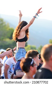 BENICASSIM, SPAIN - JULY 20: A Woman From The Crowd In A Daylight Concert At FIB Festival On July 20, 2014 In Benicassim, Spain.