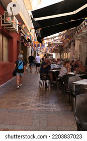 Benidorm, Alicante, Spain- September 10, 2022: Bars And Terraces Of Typical Spanish Food Full Of People In The Old Town Of Benidorm