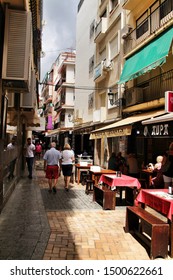 Benidorm, Alicante, Spain- September 7, 2019: Bar Of Typical Spanish Food Full Of People In The Old Town Of Benidorm