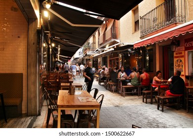 Benidorm, Alicante, Spain- September 7, 2019: Bar Of Typical Spanish Food Full Of People In The Old Town Of Benidorm