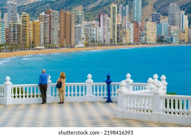 Benidorm, Costa Blanca, Spain. Senior couple on the viewpoint in the old city near the famous landmark "Mediterranean Balcony". Panoramic view of Benidorm. - Powered by Shutterstock