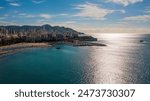 Benidorm,Alicante,Spain.Aerial photo from drone to Benidorm city skyline with beach and mountains in the background.