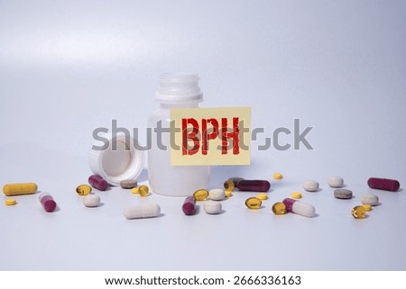 BENIGN PROSTATIC HYPERPLASIA (BPH) or prostate enlargement. Stethoscope and medication on wooden table.