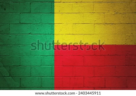 Benin flag painted on a cinder block wall.