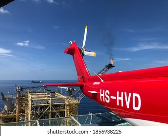 Benjamas Gasfield, Gulf of Thailand, Thailand - November 19,2020- Benjamas Living Quarter offshore installation platform with a transport helicopter and her crew Offshore Transport Helicopter 